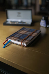 A6 Blank Pocket Notebook — pocket size in hand